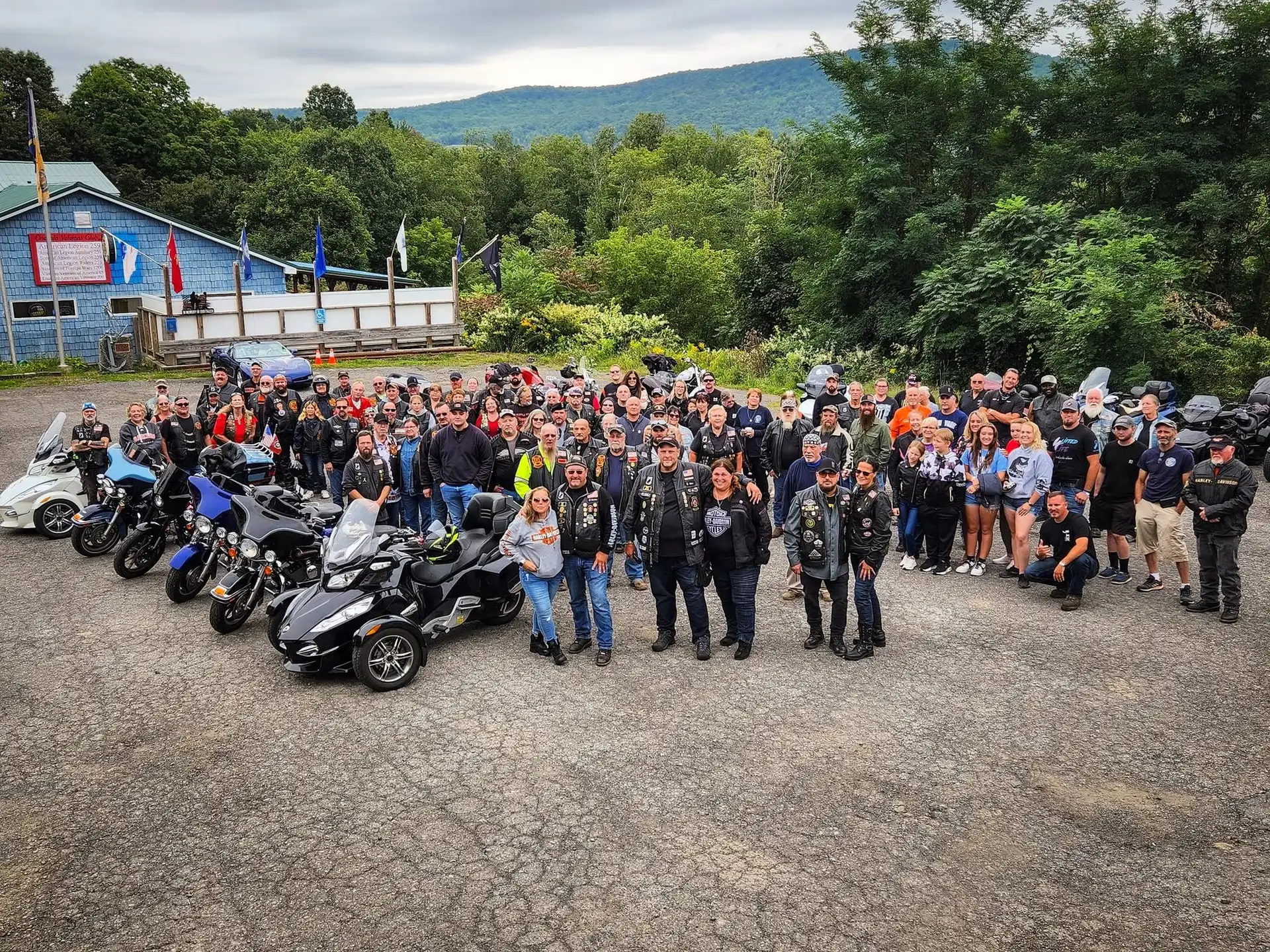 Members of ALR Post 259 gathered with their motorcycles outside the blue clubhouse